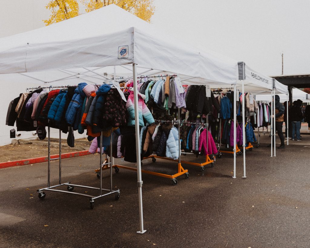 Racks of warm coats ready for families