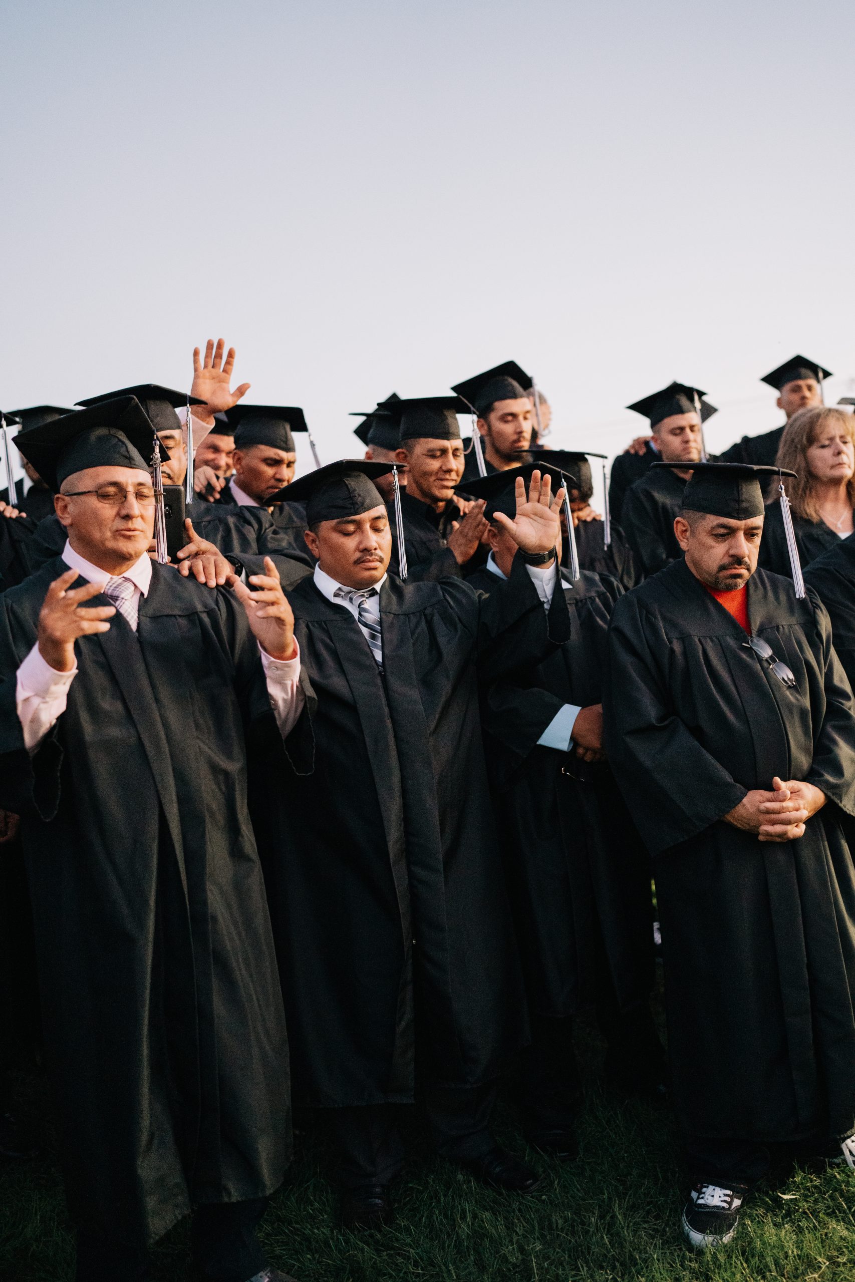 Fresno Mission graduates embracing at a past graduation ceremony